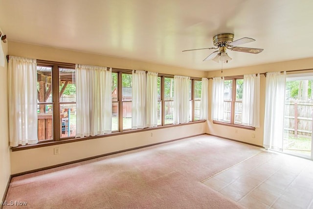 449 Westchester Dr SE, Warren, OH 44484 - unfurnished sunroom featuring baseboards and carpet
