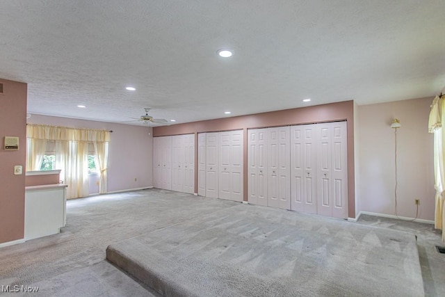 449 Westchester Dr SE, Warren, OH 44484 - unfurnished living room with carpet flooring, a ceiling fan, and recessed lighting