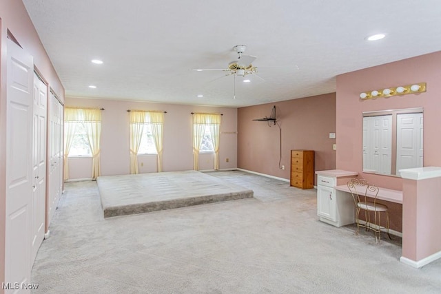 449 Westchester Dr SE, Warren, OH 44484 - unfurnished living room with light carpet, a ceiling fan, recessed lighting, and a desk