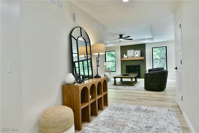 2320 Wilshire Dr, Cortland, OH 44410 - living room featuring a ceiling fan, wood finished floors, recessed lighting, a fireplace, and a raised ceiling