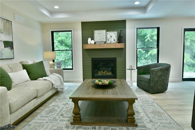 2320 Wilshire Dr, Cortland, OH 44410 - living area with a raised ceiling, wood finished floors, plenty of natural light, and recessed lighting