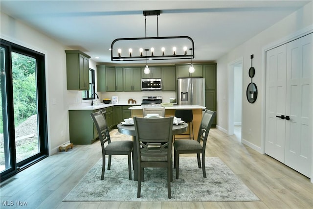 2320 Wilshire Dr, Cortland, OH 44410 - dining space with light wood-type flooring and baseboards