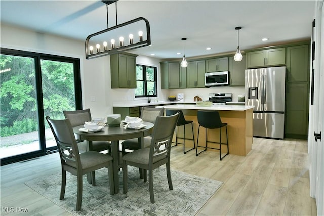 2320 Wilshire Dr, Cortland, OH 44410 - dining area with recessed lighting and light wood-style flooring