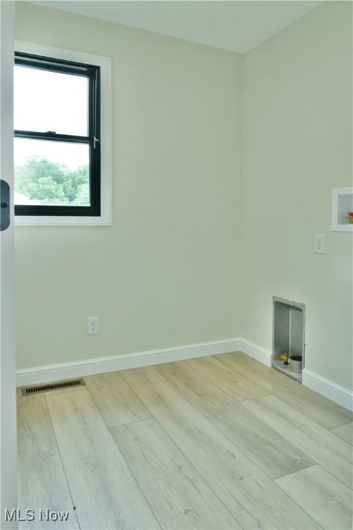 2320 Wilshire Dr, Cortland, OH 44410 - spare room featuring wood finished floors and baseboards