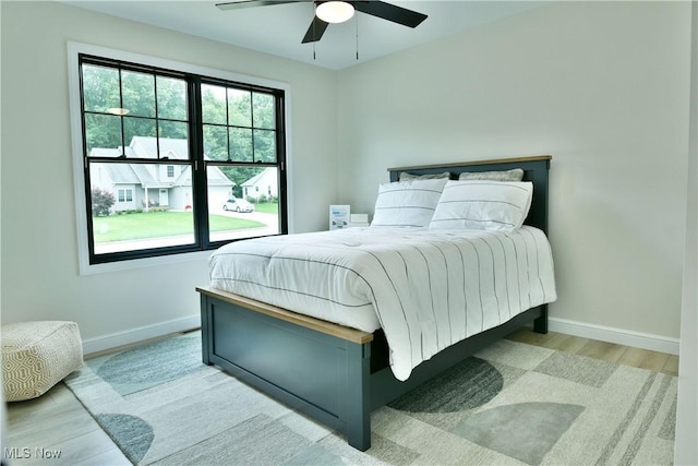 2320 Wilshire Dr, Cortland, OH 44410 - bedroom with wood finished floors and a ceiling fan