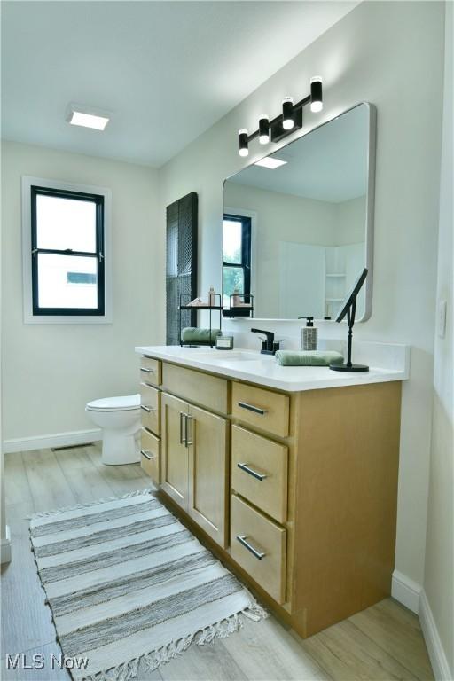 2320 Wilshire Dr, Cortland, OH 44410 - bathroom featuring vanity and wood finished floors