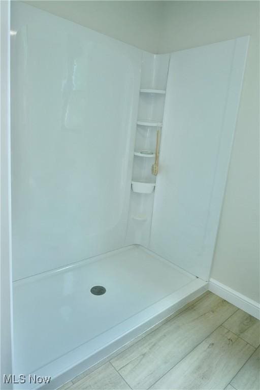 2320 Wilshire Dr, Cortland, OH 44410 - bathroom with wood finished floors and a shower