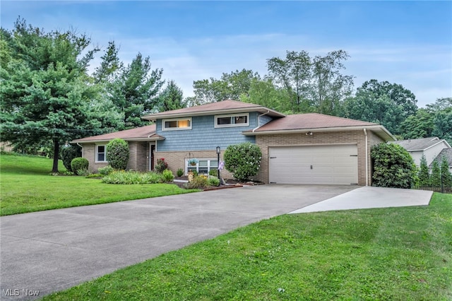 6118 Echodell Ave NW, North Canton, OH 44720 - split level home with driveway, an attached garage, brick siding, and a front yard