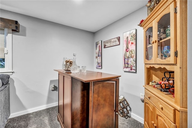 6118 Echodell Ave NW, North Canton, OH 44720 - indoor dry bar featuring baseboards and dark colored carpet
