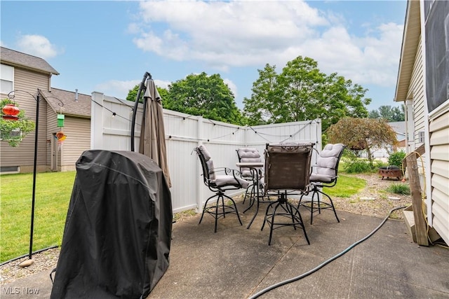 10393 Scotney Ave NW, North Canton, OH 44720 - view of patio featuring a grill and outdoor dining space
