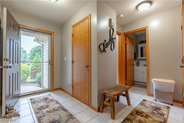10393 Scotney Ave NW, North Canton, OH 44720 - foyer entrance with light tile patterned floors and baseboards