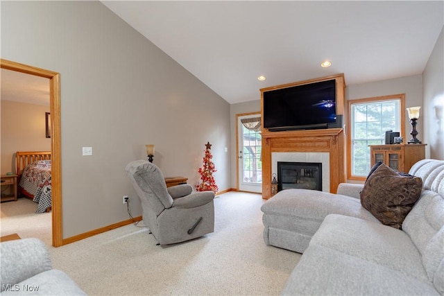 10393 Scotney Ave NW, North Canton, OH 44720 - carpeted living area with plenty of natural light, a large fireplace, recessed lighting, and lofted ceiling