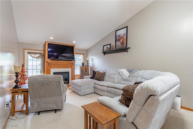 10393 Scotney Ave NW, North Canton, OH 44720 - living area with vaulted ceiling, a fireplace, and recessed lighting