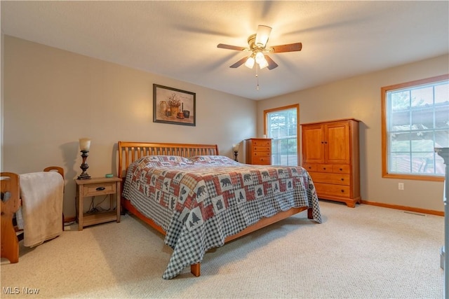 10393 Scotney Ave NW, North Canton, OH 44720 - carpeted bedroom featuring baseboards and a ceiling fan