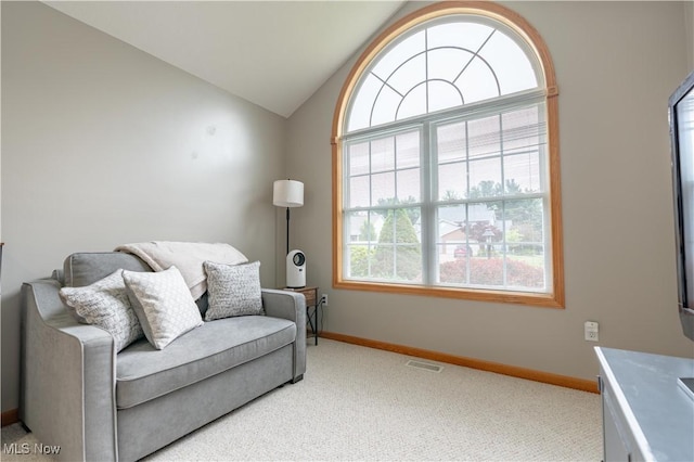 10393 Scotney Ave NW, North Canton, OH 44720 - living area with light carpet and vaulted ceiling
