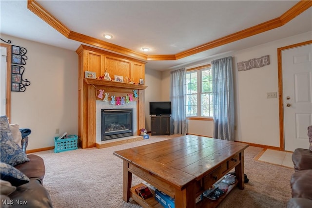 10393 Scotney Ave NW, North Canton, OH 44720 - carpeted living room with ornamental molding, a tray ceiling, and a fireplace