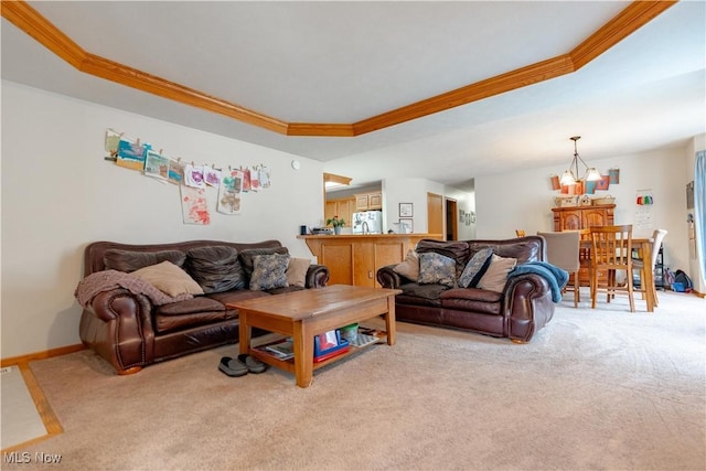 10393 Scotney Ave NW, North Canton, OH 44720 - carpeted living area featuring ornamental molding, a raised ceiling, and a chandelier