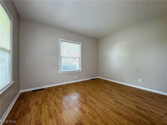 101 Ridgeway St, Struthers, OH 44471 - unfurnished room with wood finished floors and a textured ceiling