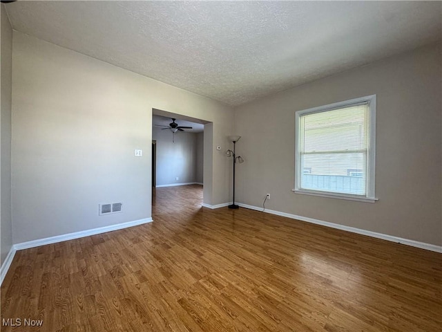 101 Ridgeway St, Struthers, OH 44471 - spare room with wood finished floors, a textured ceiling, and ceiling fan