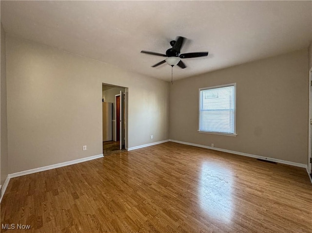 101 Ridgeway St, Struthers, OH 44471 - empty room featuring wood finished floors and ceiling fan