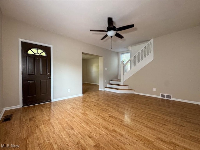 101 Ridgeway St, Struthers, OH 44471 - entrance foyer with light wood-type flooring, ceiling fan, and stairs