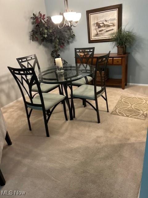 625 Canterbury Ln Unit 27A, Medina, OH 44256 - dining space featuring a chandelier and light carpet