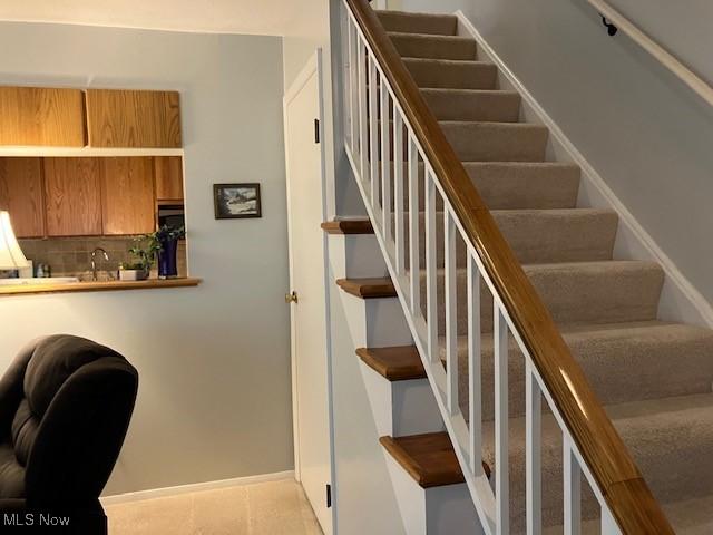 625 Canterbury Ln Unit 27A, Medina, OH 44256 - staircase with baseboards