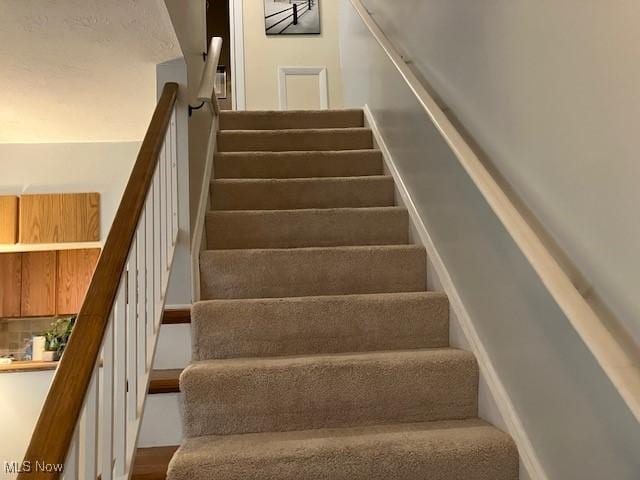 625 Canterbury Ln Unit 27A, Medina, OH 44256 - staircase featuring wood finished floors
