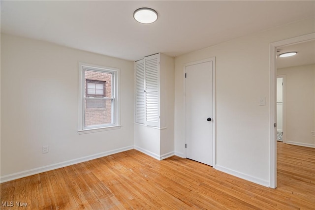 3886 Faversham Rd, University Heights, OH 44118 - unfurnished bedroom featuring light wood-style floors and a closet