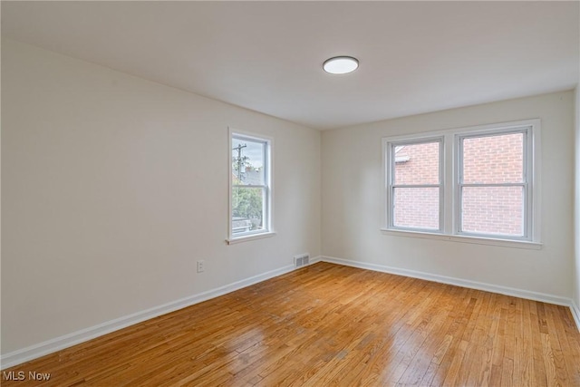 3886 Faversham Rd, University Heights, OH 44118 - empty room featuring light wood-style flooring and baseboards