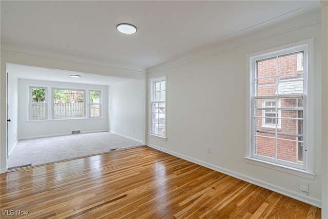 3886 Faversham Rd, University Heights, OH 44118 - unfurnished room featuring wood finished floors and ornamental molding