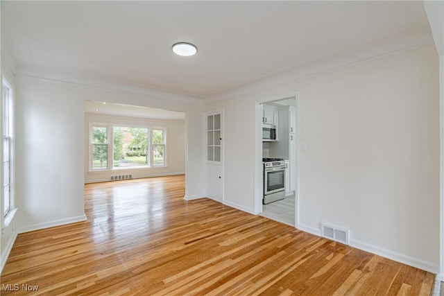 3886 Faversham Rd, University Heights, OH 44118 - spare room featuring light wood-style floors and ornamental molding