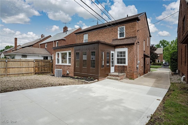 3886 Faversham Rd, University Heights, OH 44118 - rear view of house featuring brick siding and driveway