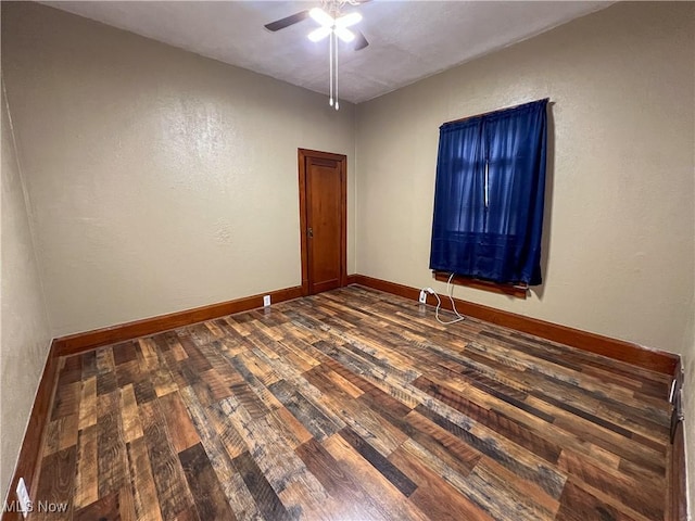 1874 Idaho Ave, East Liverpool, OH 43920 - spare room featuring dark wood-style floors, a ceiling fan, and a textured wall