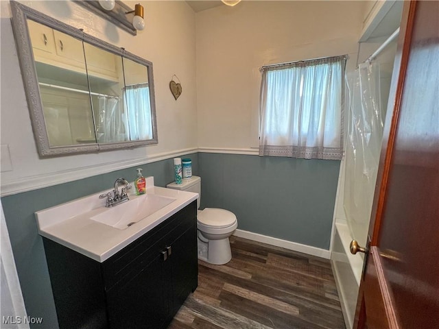 1874 Idaho Ave, East Liverpool, OH 43920 - bathroom featuring wood finished floors, vanity, and shower / bathtub combination with curtain