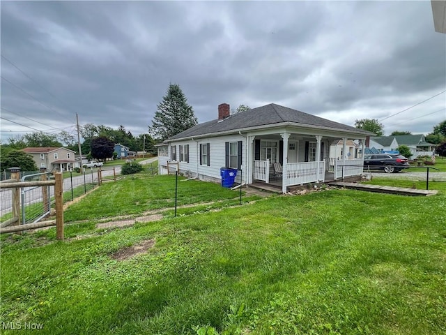 1874 Idaho Ave, East Liverpool, OH 43920 - view of property exterior featuring covered porch and a chimney