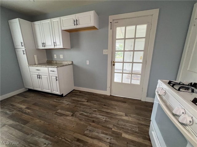 1874 Idaho Ave, East Liverpool, OH 43920 - kitchen featuring white range with gas cooktop, dark wood-type flooring, white cabinetry, and light stone countertops