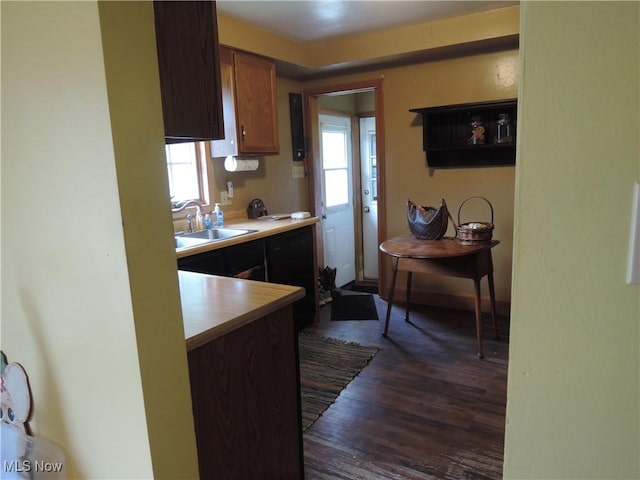 7277 Clovermeade Ave, Youngstown, OH 44514 - kitchen with dark wood-type flooring, light countertops, and brown cabinetry