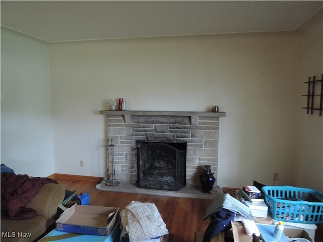 7277 Clovermeade Ave, Youngstown, OH 44514 - living area featuring a stone fireplace and wood finished floors