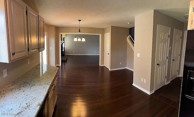 23 Fieldstone Dr, Poland, OH 44514 - hall with dark wood-style flooring, a chandelier, and a textured ceiling
