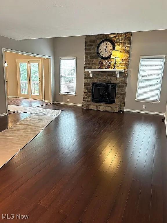 23 Fieldstone Dr, Poland, OH 44514 - unfurnished living room with a fireplace and wood-type flooring