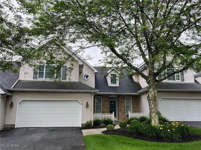 23 Fieldstone Dr, Poland, OH 44514 - view of front of property with driveway, a garage, and a shingled roof