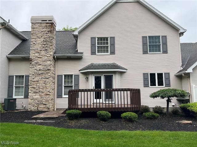 23 Fieldstone Dr, Poland, OH 44514 - back of house with a wooden deck, roof with shingles, and a chimney