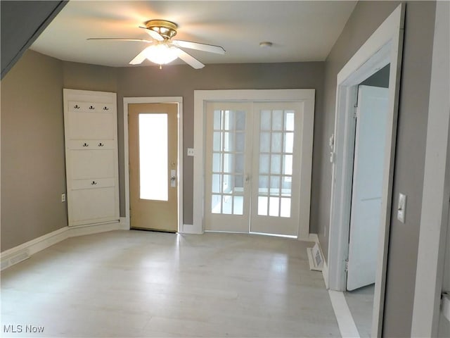 462 Monroe St, Conneaut, OH 44030 - entrance foyer with light wood-style flooring, french doors, and a ceiling fan