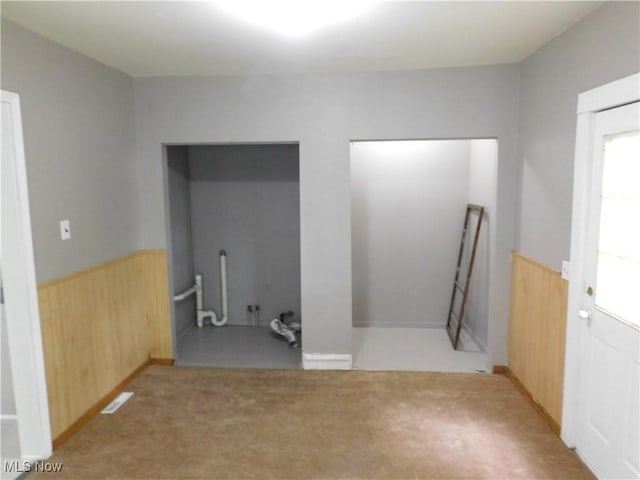 462 Monroe St, Conneaut, OH 44030 - interior space featuring a wainscoted wall, wooden walls, and carpet flooring