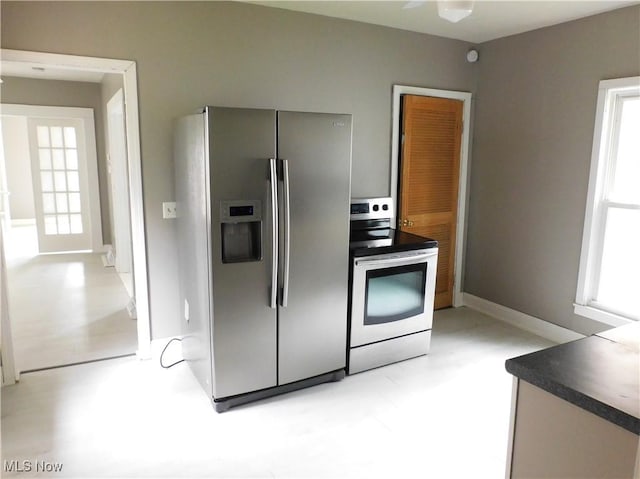 462 Monroe St, Conneaut, OH 44030 - kitchen with stainless steel appliances and dark countertops