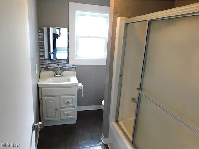 462 Monroe St, Conneaut, OH 44030 - full bathroom featuring vanity, backsplash, and combined bath / shower with glass door