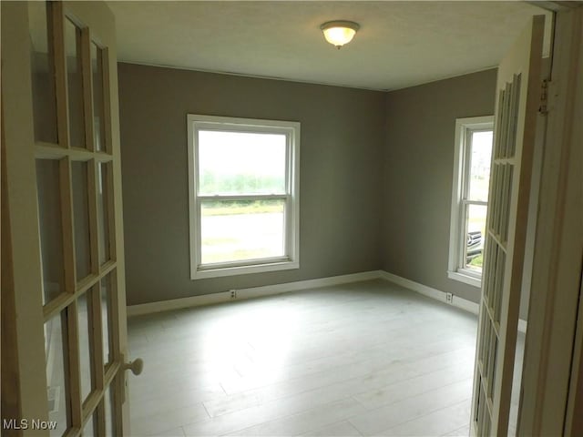 462 Monroe St, Conneaut, OH 44030 - empty room with baseboards and light wood finished floors
