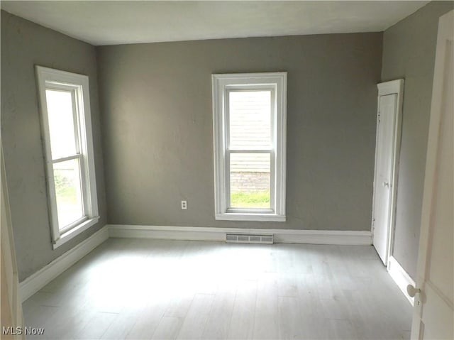 462 Monroe St, Conneaut, OH 44030 - spare room with light wood-style flooring and baseboards