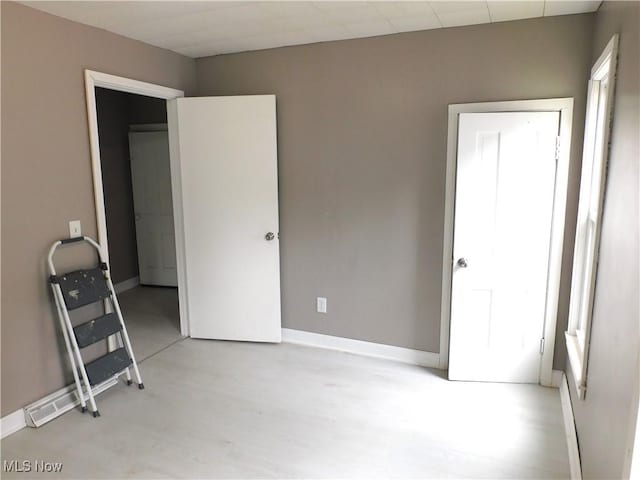 462 Monroe St, Conneaut, OH 44030 - unfurnished bedroom featuring baseboards and light wood-style floors